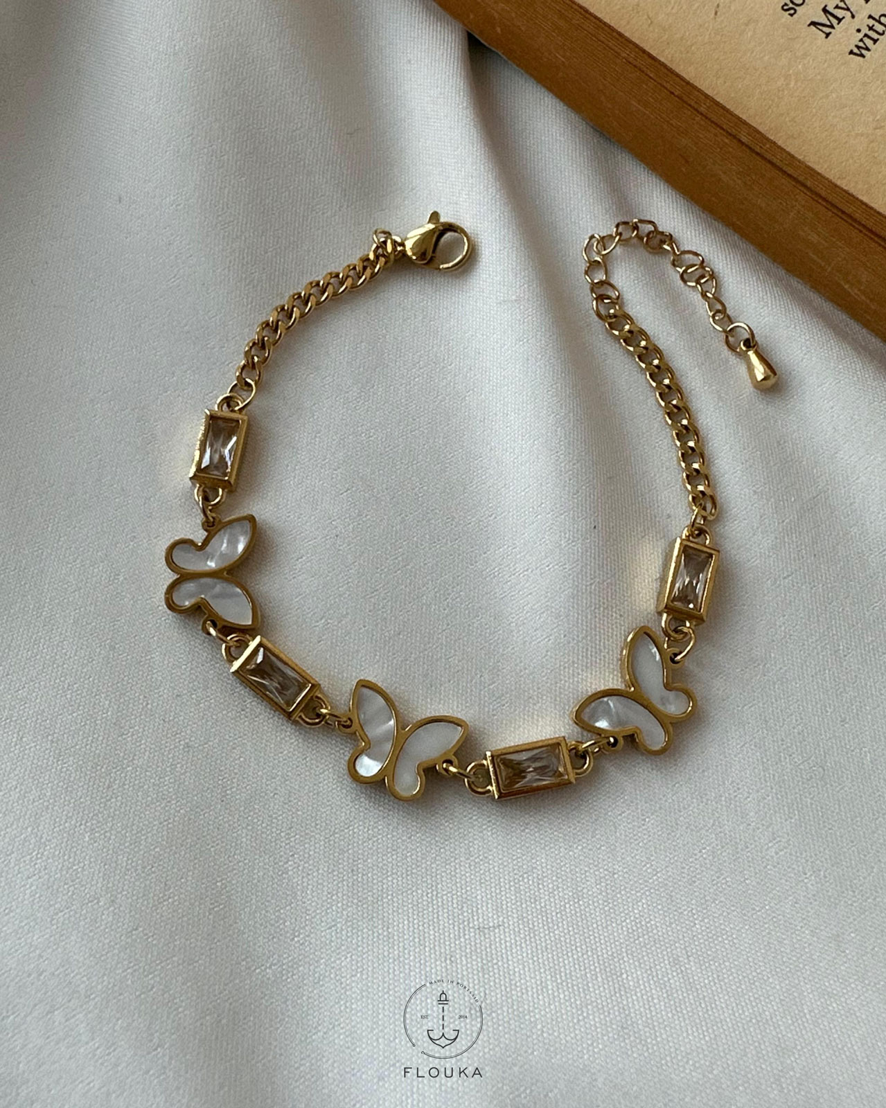 1708382348_B0096.jpg white straus butterfly bracelet