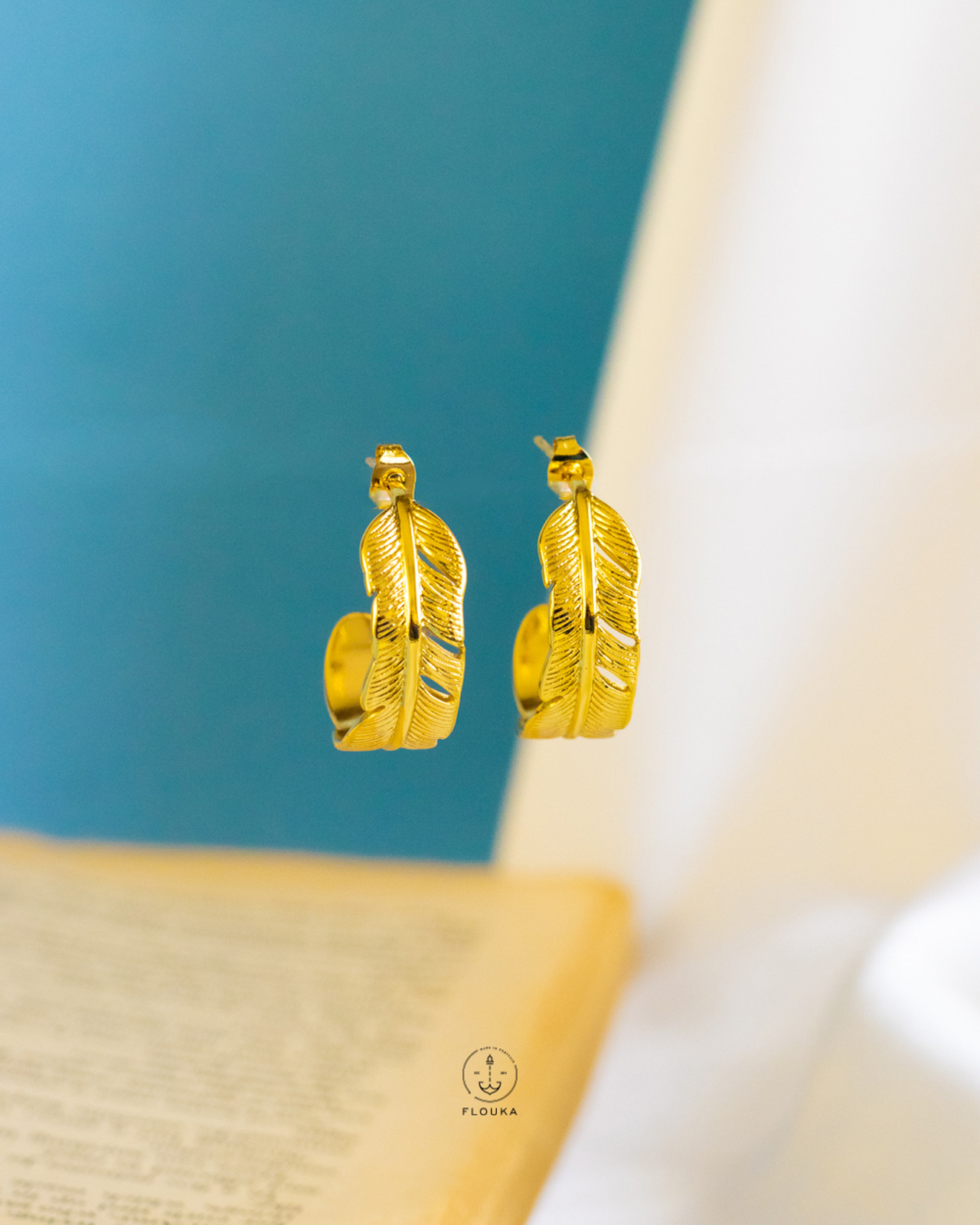 1724166720_e0395.jpg feather gold earrings