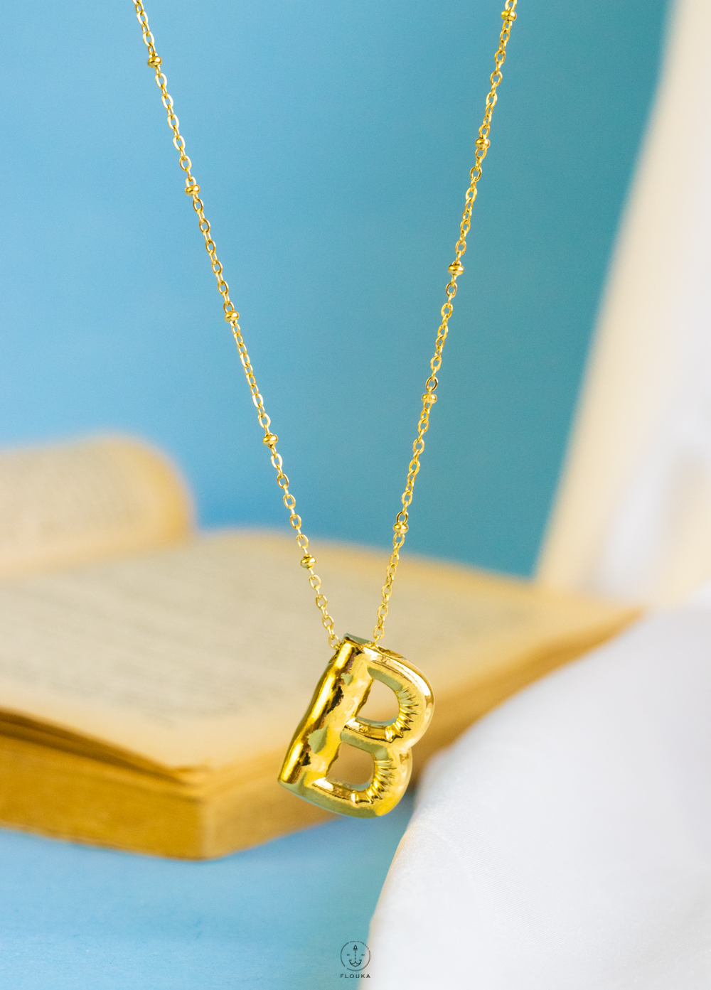 1724172852_n0666.jpg gold helium letter B necklace