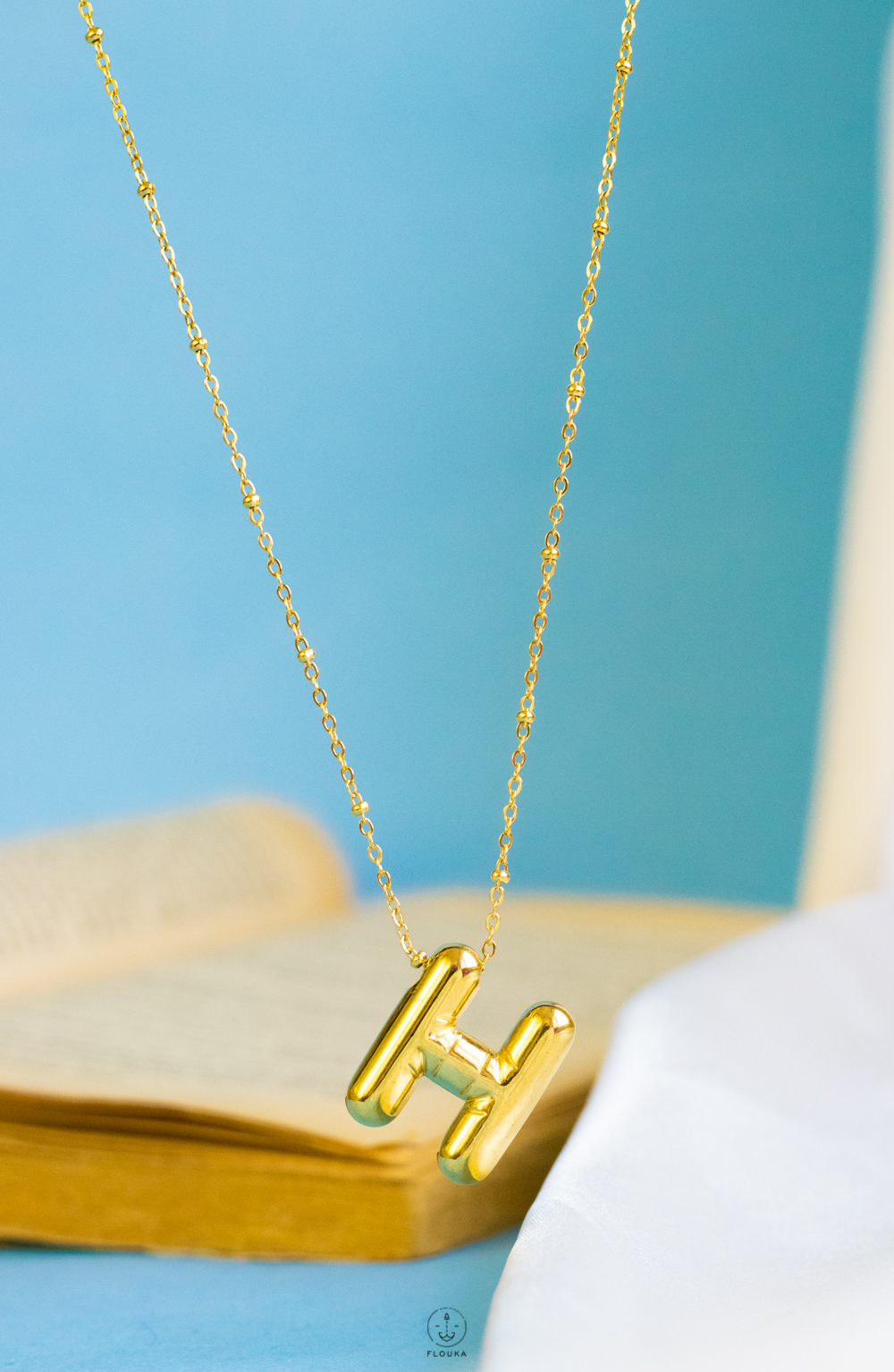 1724173038_n0663.jpg gold helium letter H necklace