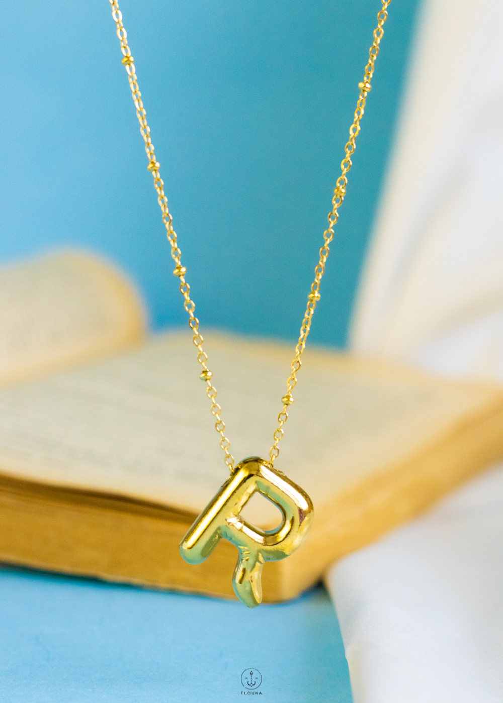 1724237511_n0657.jpg gold helium letter R necklace