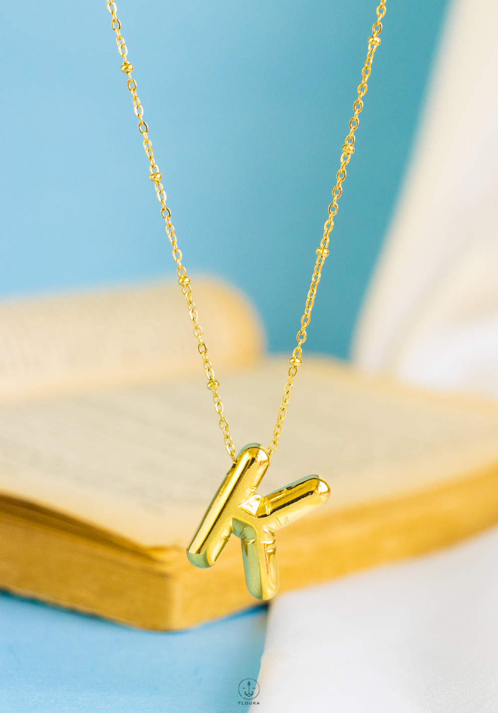 1724237560_n0664.jpg gold helium letter K necklace