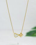 thin white heart letter M necklace
