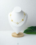 white & gold vancleef necklace