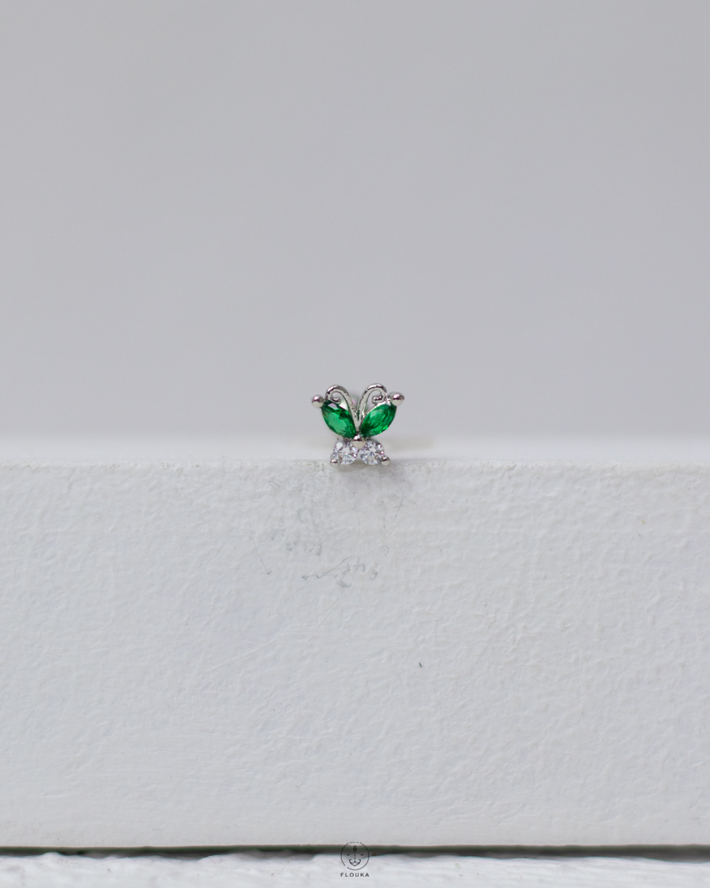 1746635711_c0122.jpg green silver butterfly piercing