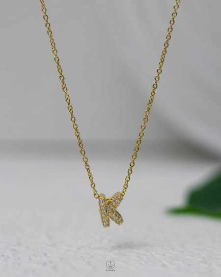 litter K gold strus necklace