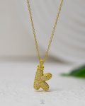 litter K gold strus necklace