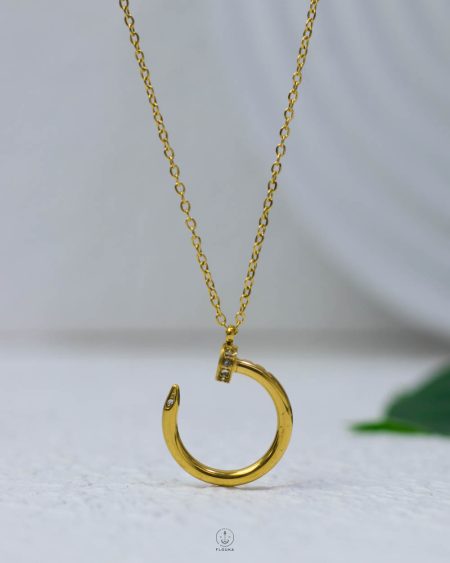 white strues gold nail necklace