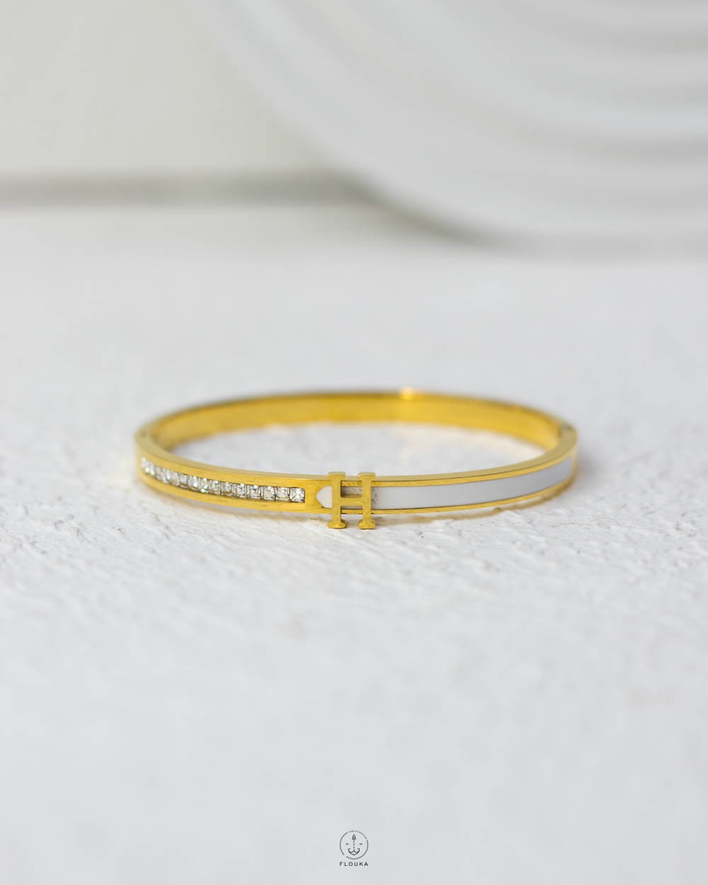 1754235673_O0724-1.jpg litter H white struas gold and white bracelet