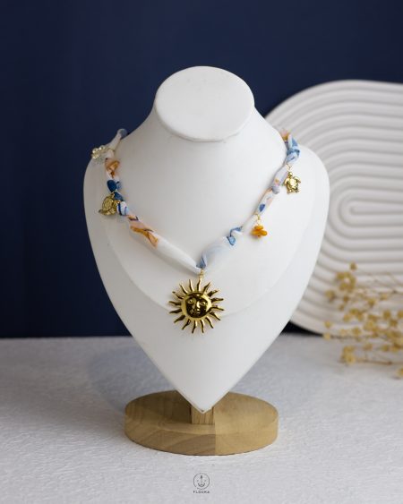 baby blue fagbric gold sun necklace
