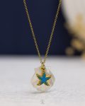 white rasin seashell & blue seastar gold necklace