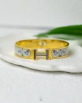 gold & white hermes bracelet