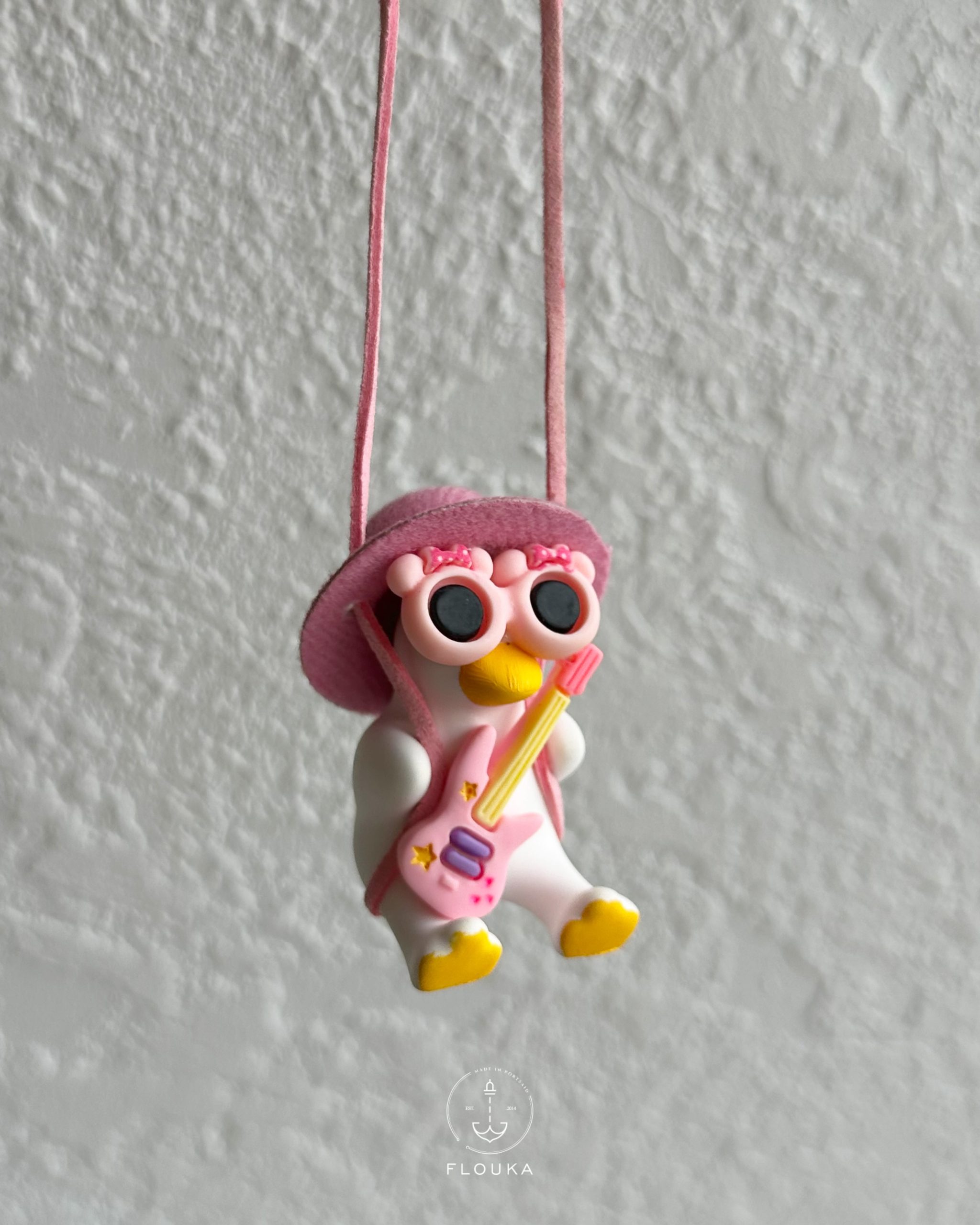 1759587368_photo-output-2.jpeg pink Duck with Guitar carholder