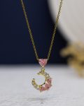 pink struas crescent gold necklace