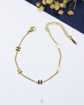 tiny gold hermes bracelet