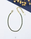 tiny green tennis gold bracelet