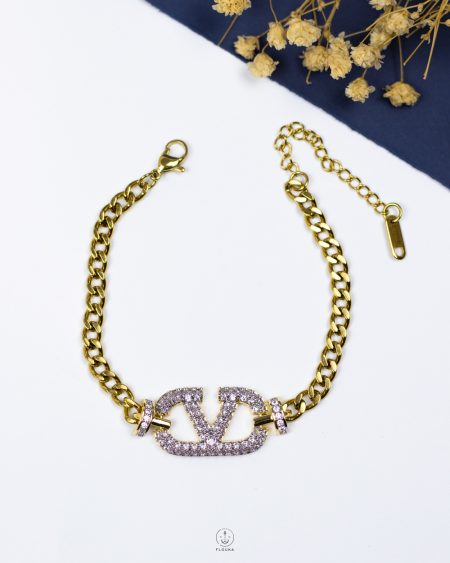 white struas Valentino gold bracelet