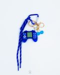 blue game console & cherry keychain
